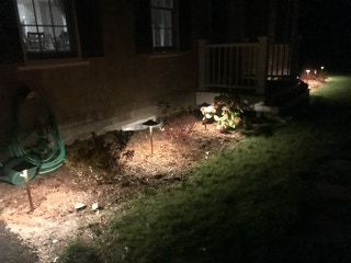 garden lit at night by Dependable Landscaping